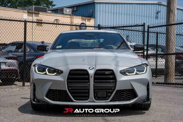 used 2024 BMW M4 car, priced at $77,500