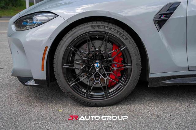 used 2024 BMW M4 car, priced at $77,500