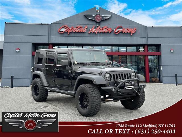 used 2014 Jeep Wrangler Unlimited car, priced at $14,977