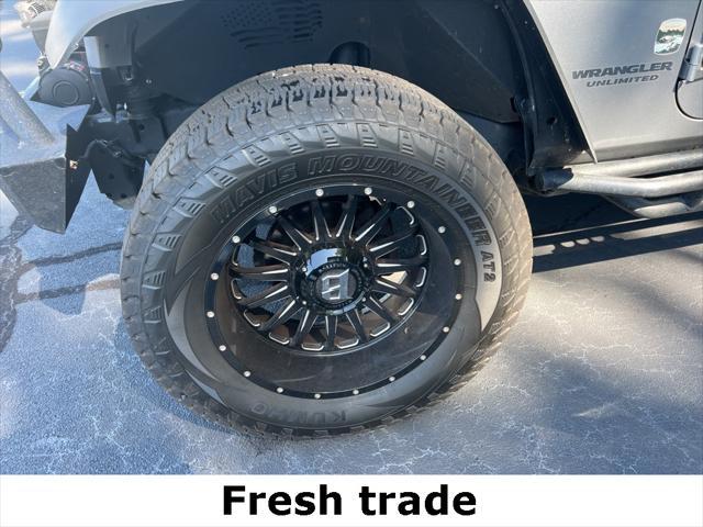 used 2015 Jeep Wrangler Unlimited car, priced at $16,990