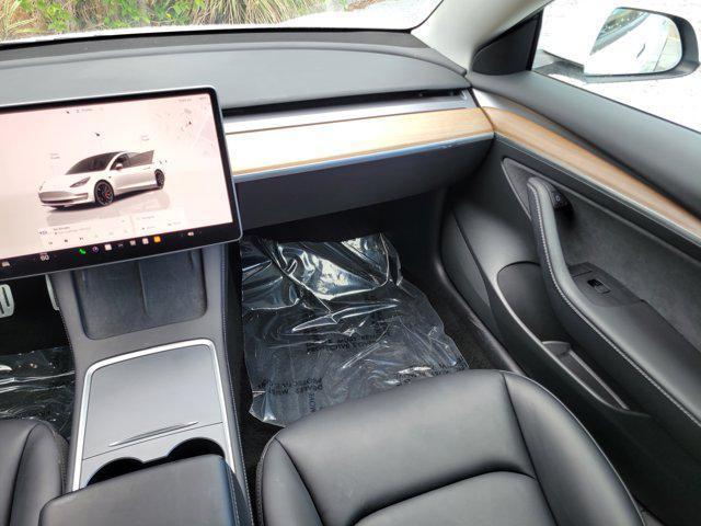 used 2022 Tesla Model 3 car, priced at $27,556