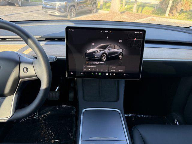 used 2024 Tesla Model Y car, priced at $35,894