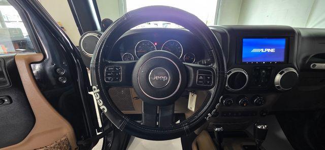 used 2011 Jeep Wrangler Unlimited car, priced at $14,286