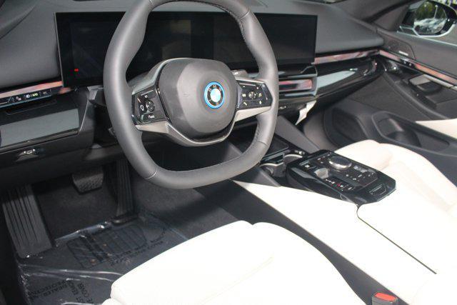 used 2025 BMW i5 car, priced at $59,928