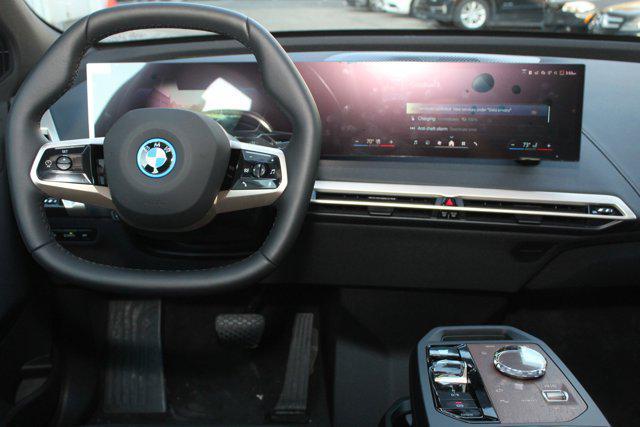 new 2025 BMW iX car, priced at $103,025