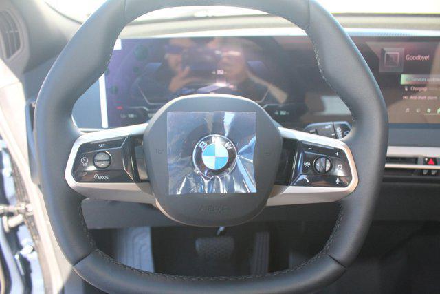 new 2026 BMW iX car, priced at $97,825