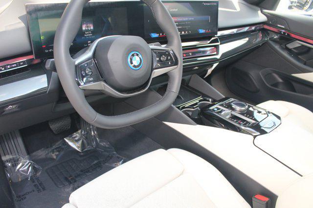 used 2025 BMW i5 car, priced at $62,048