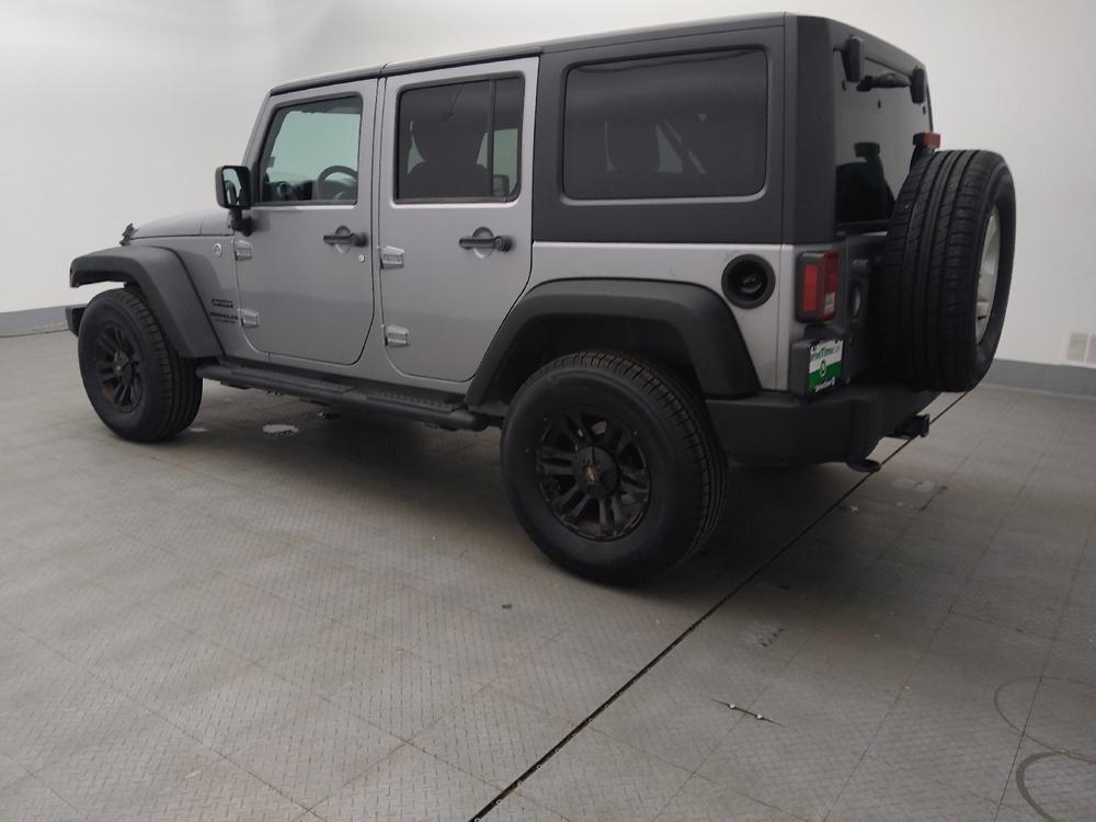 used 2013 Jeep Wrangler Unlimited car, priced at $19,395
