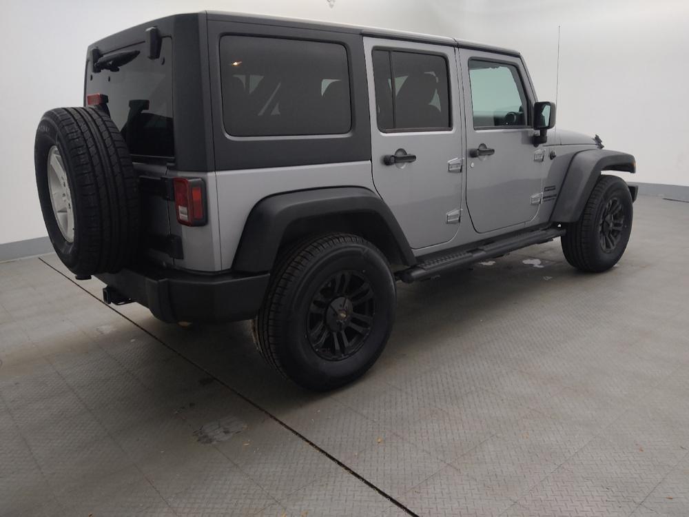 used 2013 Jeep Wrangler Unlimited car, priced at $19,395