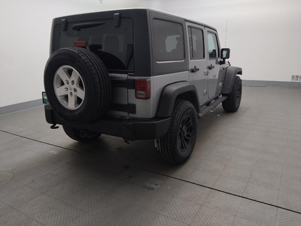 used 2013 Jeep Wrangler Unlimited car, priced at $19,395