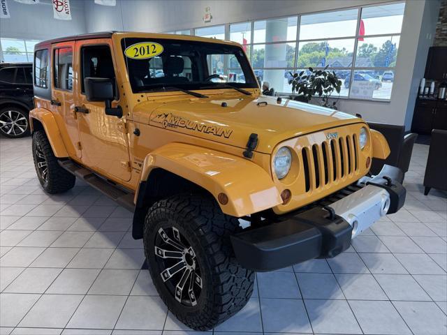 used 2012 Jeep Wrangler Unlimited car, priced at $13,991