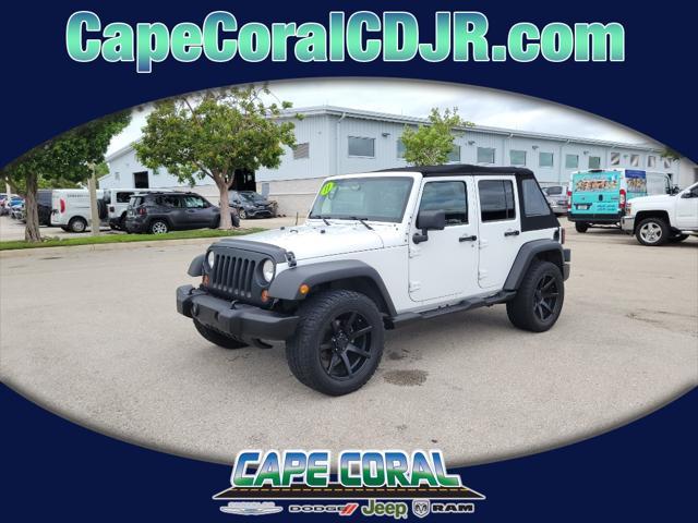 used 2011 Jeep Wrangler Unlimited car, priced at $18,428