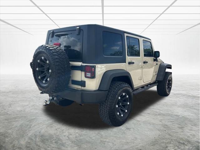 used 2011 Jeep Wrangler Unlimited car, priced at $13,144