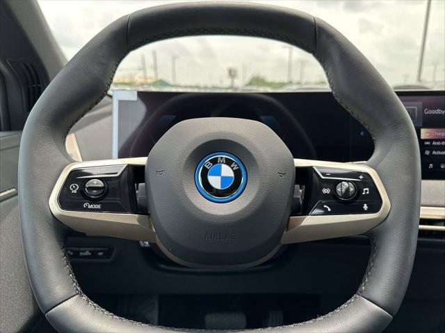 new 2024 BMW iX car, priced at $97,495