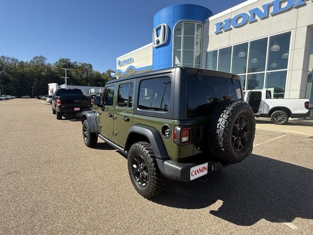 used 2021 Jeep Wrangler Unlimited car, priced at $31,556