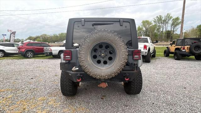 used 2014 Jeep Wrangler Unlimited car, priced at $18,599