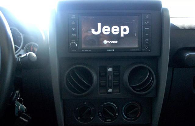 used 2010 Jeep Wrangler Unlimited car, priced at $13,999