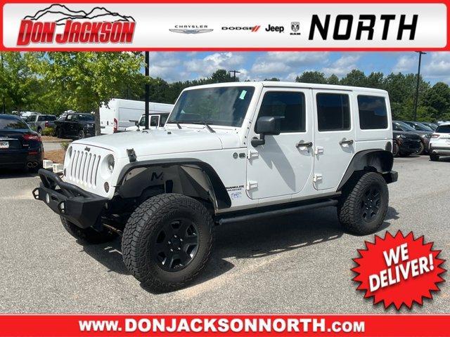 used 2012 Jeep Wrangler Unlimited car, priced at $13,995