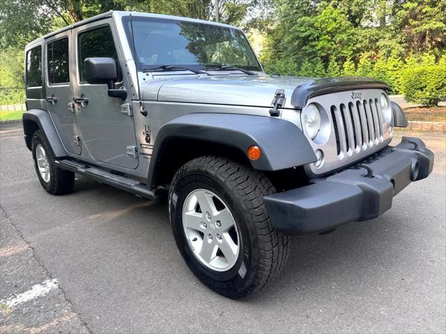 used 2014 Jeep Wrangler Unlimited car, priced at $14,795