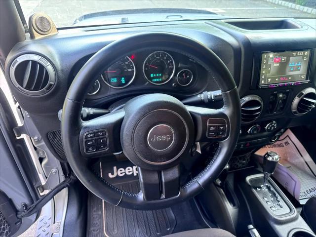 used 2014 Jeep Wrangler Unlimited car, priced at $14,795