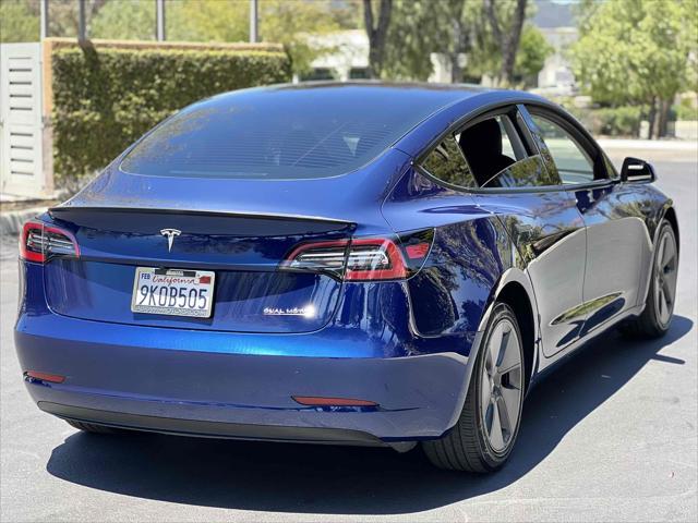 used 2023 Tesla Model 3 car, priced at $19,500