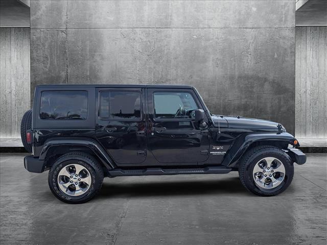 used 2016 Jeep Wrangler Unlimited car, priced at $23,077