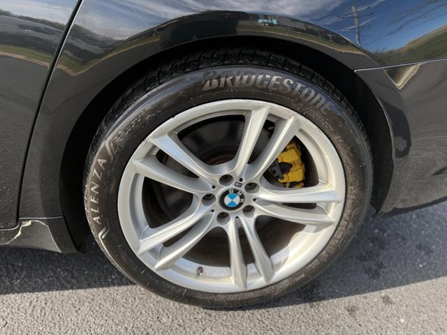 used 2010 BMW 750 car, priced at $6,995