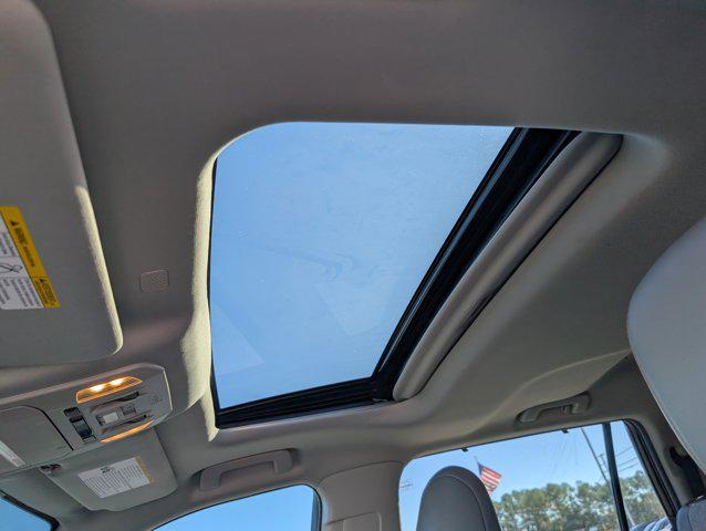 used 2022 Toyota Highlander Hybrid car, priced at $25,307