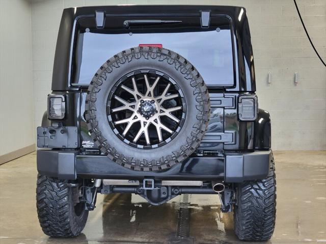 used 2014 Jeep Wrangler Unlimited car, priced at $25,865