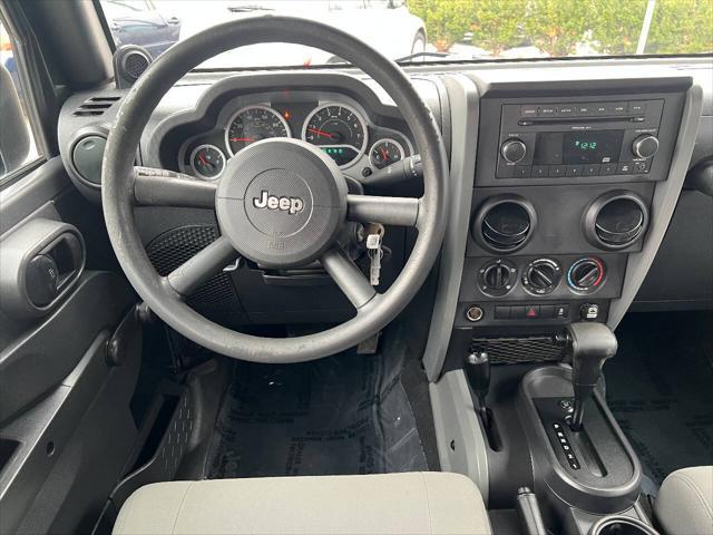 used 2010 Jeep Wrangler Unlimited car, priced at $14,490