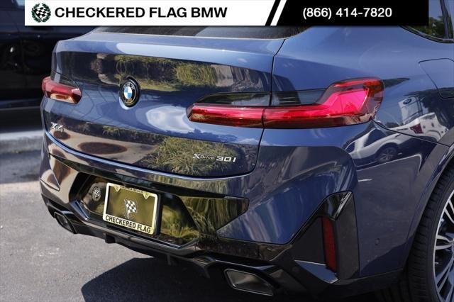 used 2025 BMW X4 car, priced at $55,472