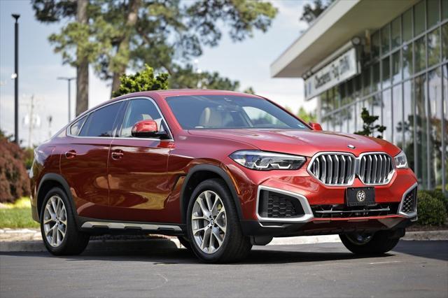 used 2022 BMW X6 car, priced at $57,060