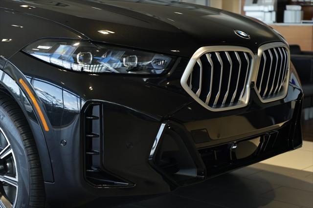 new 2025 BMW X6 car, priced at $77,875