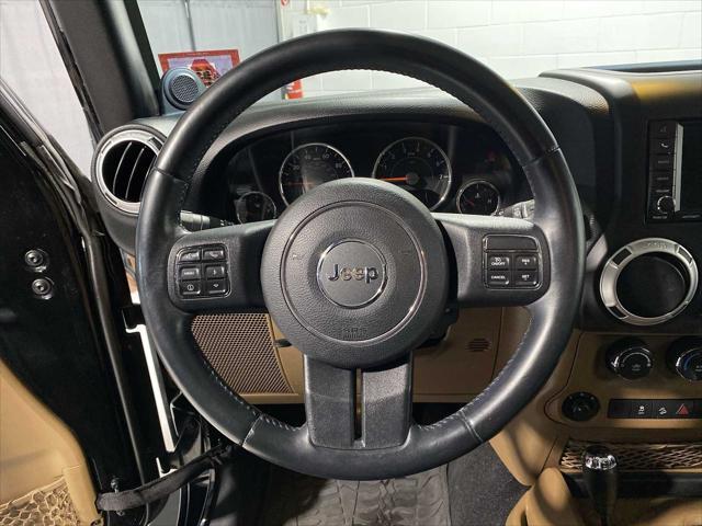 used 2014 Jeep Wrangler Unlimited car, priced at $17,480