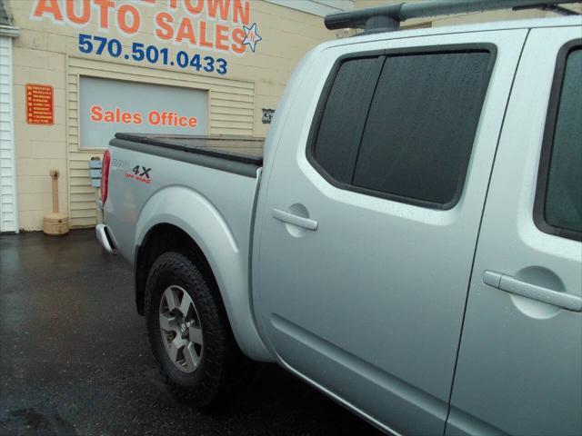 used 2011 Nissan Frontier car, priced at $14,999