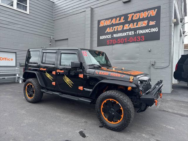 used 2012 Jeep Wrangler Unlimited car, priced at $13,999