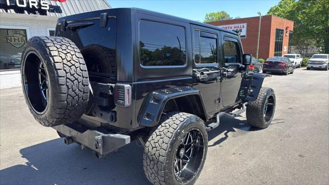 used 2014 Jeep Wrangler Unlimited car, priced at $23,999