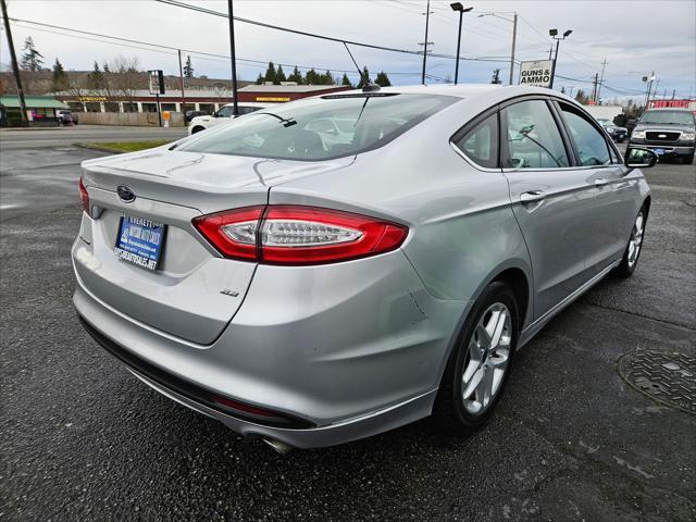 used 2014 Ford Fusion car, priced at $6,999