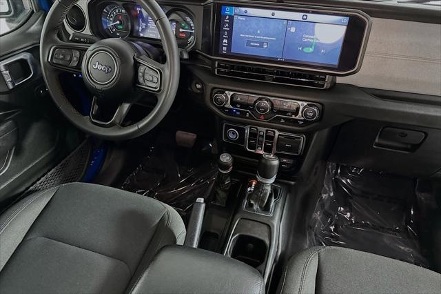 used 2024 Jeep Wrangler 4xe car, priced at $33,894