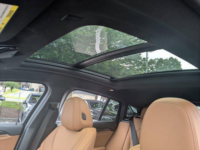 used 2025 BMW X4 car, priced at $53,488