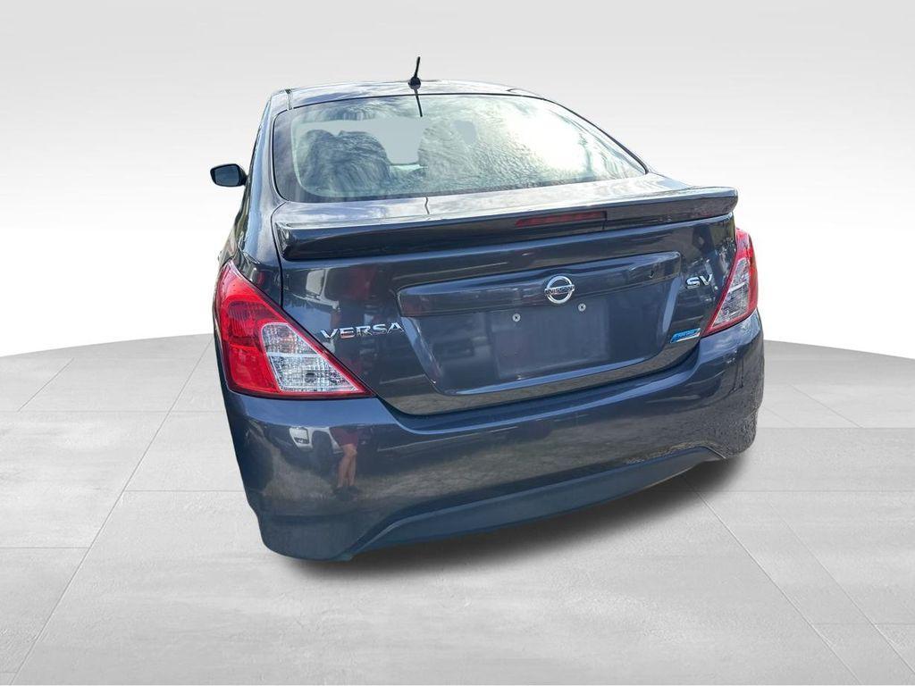 used 2015 Nissan Versa car, priced at $5,400