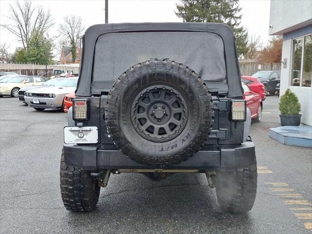 used 2014 Jeep Wrangler Unlimited car, priced at $15,995