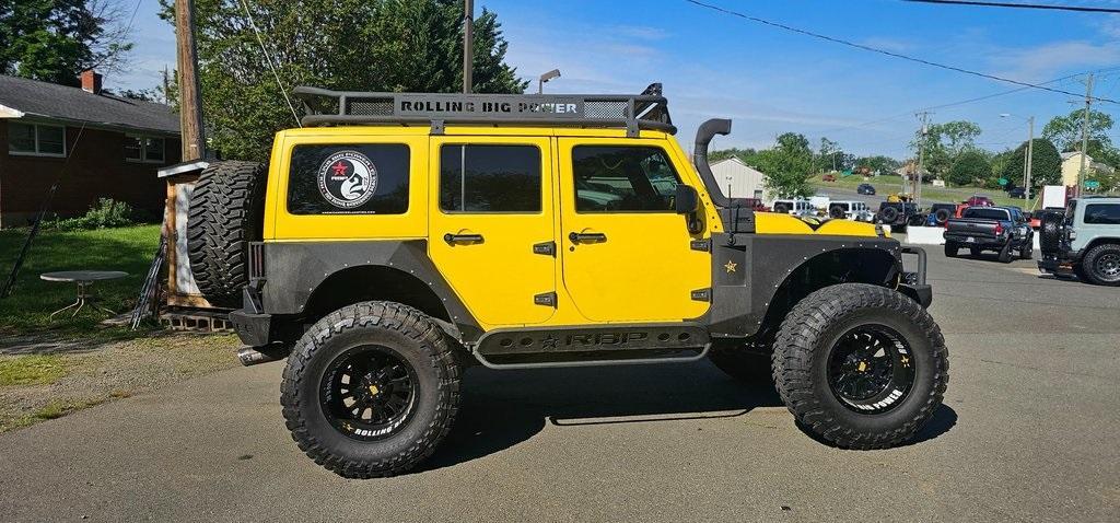 used 2013 Jeep Wrangler Unlimited car, priced at $29,990