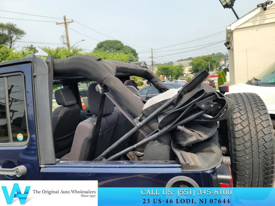used 2013 Jeep Wrangler Unlimited car, priced at $13,497