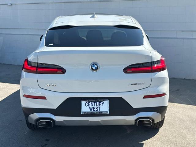 used 2025 BMW X4 car, priced at $52,520