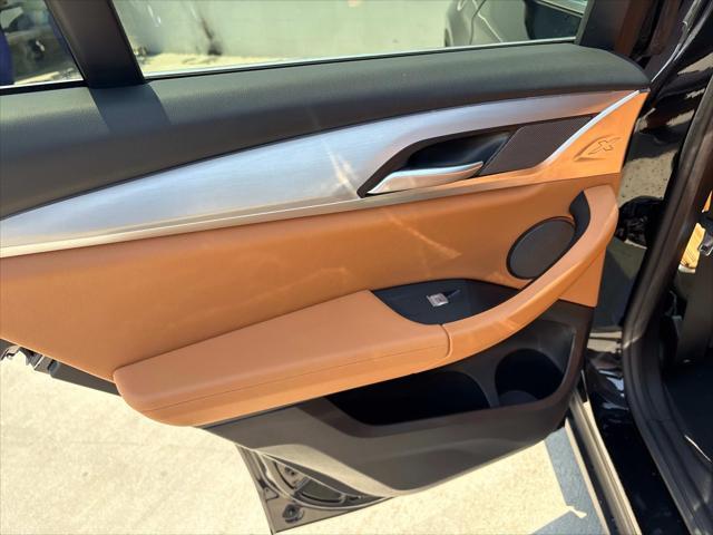 used 2024 BMW X4 car, priced at $48,820