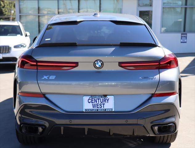 new 2025 BMW X6 car, priced at $83,900