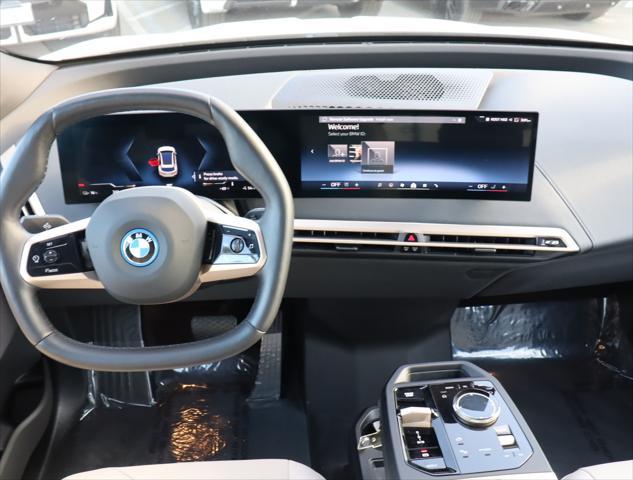 used 2024 BMW iX car, priced at $74,995