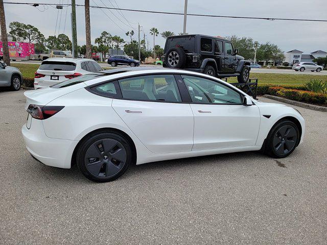 used 2023 Tesla Model 3 car, priced at $25,890