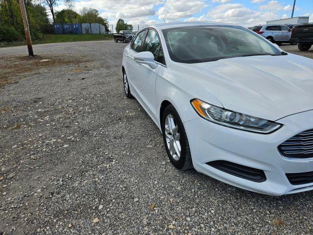 used 2016 Ford Fusion car, priced at $6,052